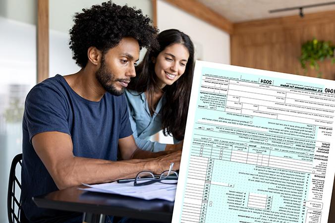 An IRS form 1040 and two people sitting at a desk filling out forms.